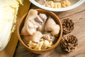 trotter soup with wooden background