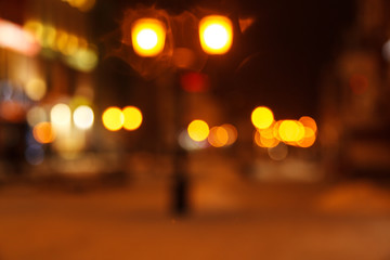 Blurred background of colored lights from lanterns. Image of abstract blurred bokeh background with colored lights. Christmas street lights, blur, bokeh, bokeh lights, bokeh background