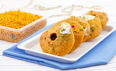 Indian Traditional Sweet Kachori Also Know As Mawa Kachori, Kachauri or Kachodi, Stuffed Kachori With Condensed Milk, Cheese and Dry Fruits And Served With Sugar Syrup