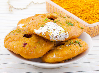 Indian Traditional Sweet Kachori Also Know As Mawa Kachori, Kachauri or Kachodi, Stuffed Kachori With Condensed Milk, Cheese and Dry Fruits And Served With Sugar Syrup