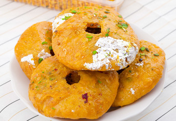 Indian Traditional Sweet Kachori Also Know As Mawa Kachori, Kachauri or Kachodi, Stuffed Kachori With Condensed Milk, Cheese and Dry Fruits And Served With Sugar Syrup