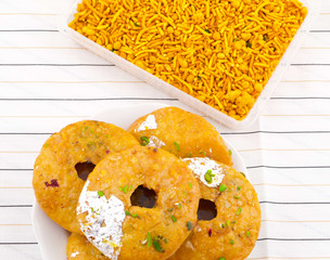 Indian Traditional Sweet Kachori Also Know As Mawa Kachori, Kachauri or Kachodi, Stuffed Kachori With Condensed Milk, Cheese and Dry Fruits And Served With Sugar Syrup