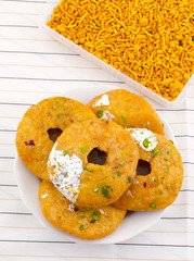Indian Traditional Sweet Kachori Also Know As Mawa Kachori, Kachauri or Kachodi, Stuffed Kachori With Condensed Milk, Cheese and Dry Fruits And Served With Sugar Syrup