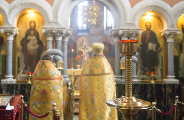 Priest during public worship in altar in the temple Orthodox Church. Church interior.