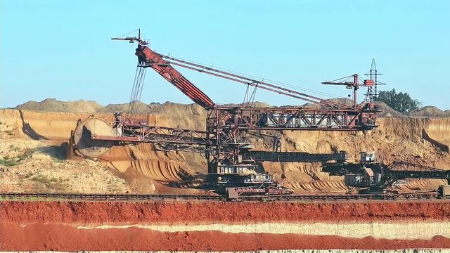 Work of the bucket wheel excavator. Production of manganese ore in the largest field in Europe. Open development.  Metallurgical industry in Ukraine, Nikopol distrikt.