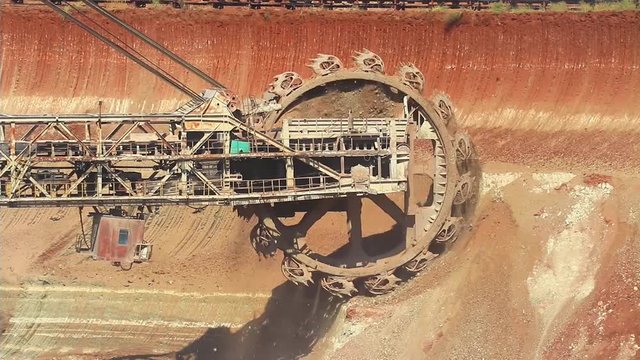 Work of the bucket wheel excavator. Production of manganese ore in the largest field in Europe. Open development.  Metallurgical industry in Ukraine, Nikopol distrikt.
