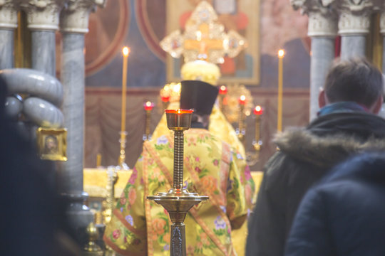 Priest during public worship in altar in the temple Orthodox Church. Church interior.