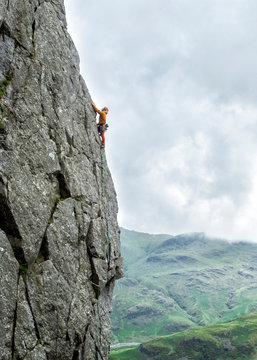 United Kingdom, Lake District, Langdale Valley, Gimmer Crag, climber on rock face