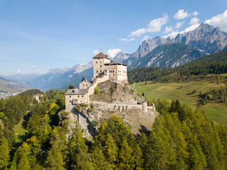 Aerial view of Castle Tarasp (built in the 11th century) in Swiss Alps, Canton Grisons or Graubuendon, Switzerland