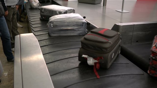 suitcases on a luggage band