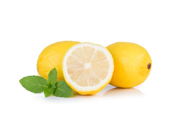 Yellow lemon with mint on a white background