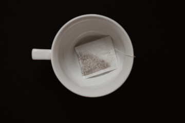 Tea bag in a white cup