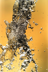 Water splashing in inversion as an abstract background