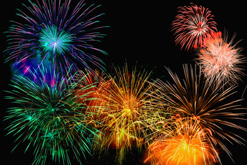 Fireworks of various color bursting against on  black background in festival holiday happy new year