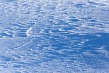 White snow on the mountainside as a background