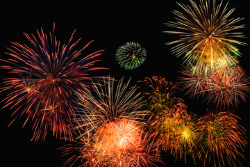 Fireworks of various color bursting against on  black background in festival holiday happy new year