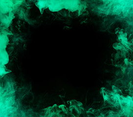 frame from aquamarine smoke over black background © arts