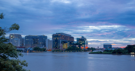 Fototapeta premium Siriraj Hospital A major government hospital in Bangkok, Thailand situated by the Chao Phraya River with twilight light.