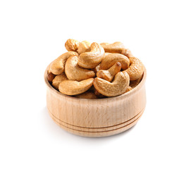 Tasty cashew nuts in bowl isolated on white