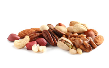 Pile of mixed organic nuts on white background