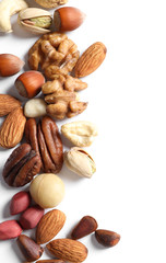 Mixed organic nuts on white background, top view. Space for text