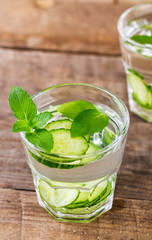 Cucumber water. Summer cool water with mint on table