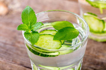 Cucumber water. Summer cool water with mint on table