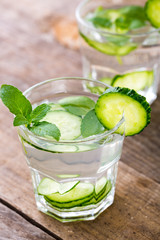 Cucumber water. Summer cool water with mint on table