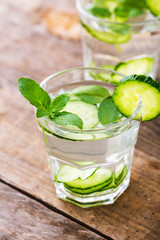 Cucumber water. Summer cool water with mint on table