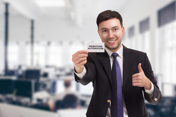 Business, technology, internet and networking concept. Young entrepreneur showing keyword:...