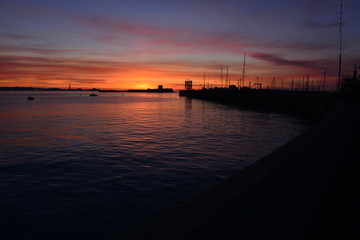 Fototapeta na wymiar St Aubins Harbour, Jersey, U.K. Winter sunrise on Boxing Day.