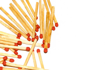 Chaotic scattered matches on a white background.