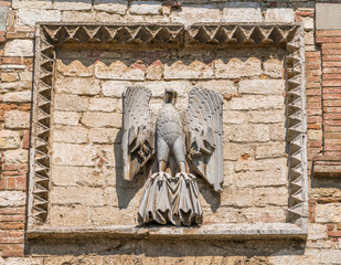 Eagle symbol on the Porta della Catena in Todi, Province of Perugia, Umbria, Italy.