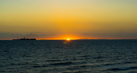 Fototapeta premium Sunset with freighter