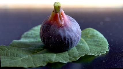 Fresh figs on black background