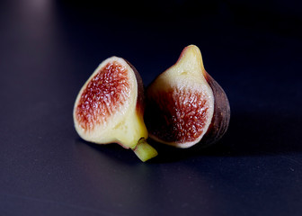 Fresh figs on black background