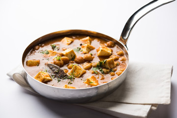 Chole Paneer curry made using boiled chickpea with cottage cheese with spices. Popular North Indian recipe. served in a bowl or serving pan. Selective focus
