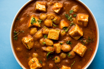 Chole Paneer curry made using boiled chickpea with cottage cheese with spices. Popular North Indian recipe. served in a bowl or serving pan. Selective focus