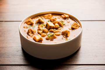 Chole Paneer curry made using boiled chickpea with cottage cheese with spices. Popular North Indian recipe. served in a bowl or serving pan. Selective focus