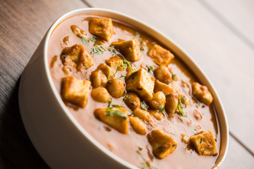 Chole Paneer curry made using boiled chickpea with cottage cheese with spices. Popular North Indian recipe. served in a bowl or serving pan. Selective focus