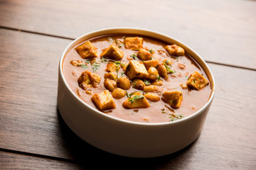 Chole Paneer curry made using boiled chickpea with cottage cheese with spices. Popular North Indian recipe. served in a bowl or serving pan. Selective focus