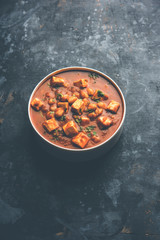 Chole Paneer curry made using boiled chickpea with cottage cheese with spices. Popular North Indian recipe. served in a bowl or serving pan. Selective focus