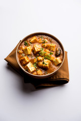 Chole Paneer curry made using boiled chickpea with cottage cheese with spices. Popular North Indian recipe. served in a bowl or serving pan. Selective focus