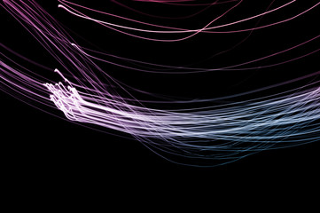 Abstract background of long explosure tale purple and blue light