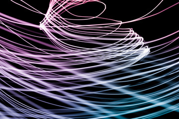 Abstract background of long explosure tale purple and blue light