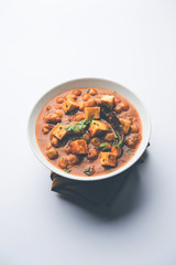 Chole Paneer curry made using boiled chickpea with cottage cheese with spices. Popular North Indian recipe. served in a bowl or serving pan. Selective focus