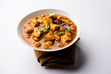 Chole Paneer curry made using boiled chickpea with cottage cheese with spices. Popular North Indian recipe. served in a bowl or serving pan. Selective focus