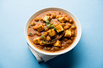 Chole Paneer curry made using boiled chickpea with cottage cheese with spices. Popular North Indian recipe. served in a bowl or serving pan. Selective focus