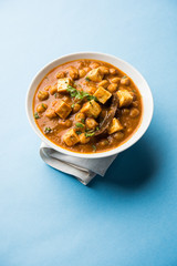 Chole Paneer curry made using boiled chickpea with cottage cheese with spices. Popular North Indian recipe. served in a bowl or serving pan. Selective focus