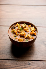 Chole Paneer curry made using boiled chickpea with cottage cheese with spices. Popular North Indian recipe. served in a bowl or serving pan. Selective focus